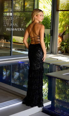 A woman in the Primavera Long Beaded Ruffled Prom Dress 4122 stands near an indoor pool, with "PRIMAVERA" displayed to the left.