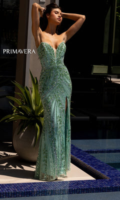 A woman poses by a pool in the Strapless Primavera Long Beaded Formal Dress 4134, a mint green gown with beads and a high slit. The text "PRIMAVERA" appears on the left, highlighting this gorgeous formal dress.