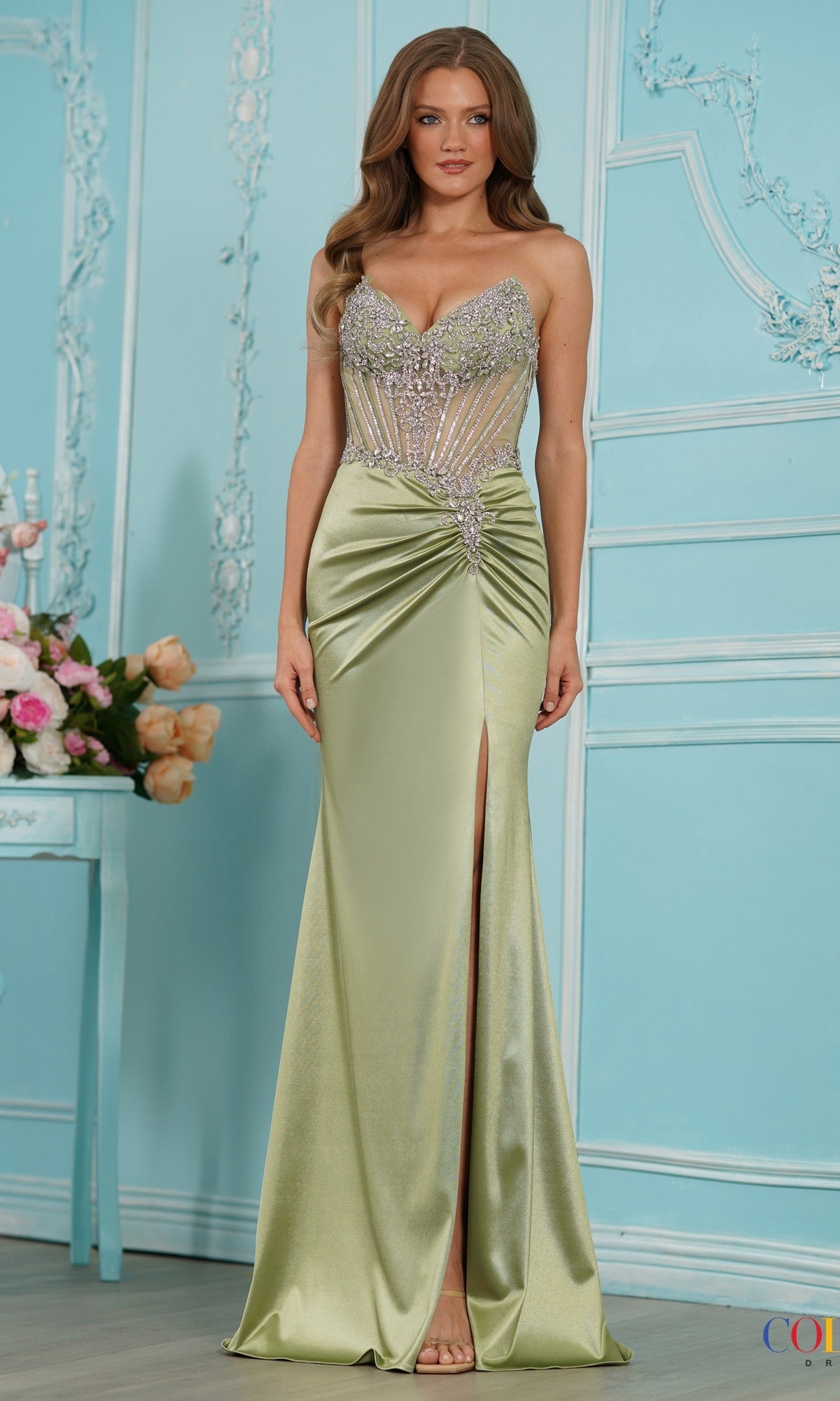 Sage green Colors Dress 4135 floor-length corset prom dress with a beaded bodice and a high thigh slit.
