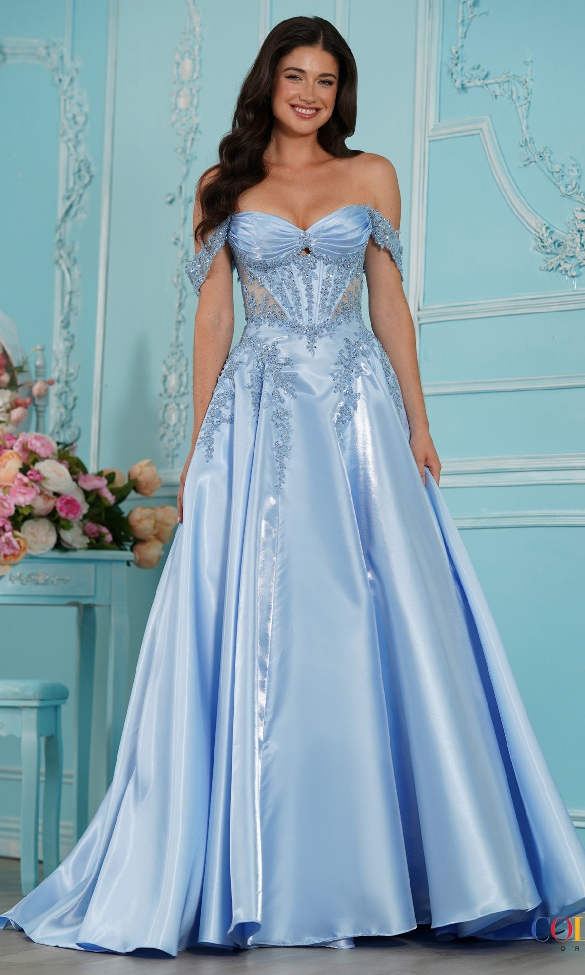 A woman wearing a blue, off-the-shoulder A-line Long Prom Dress: Colors Dress 4150 with a corset-style bodice and lace embellishments.