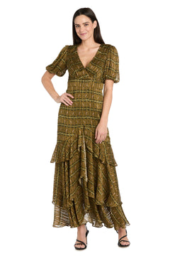 A woman stands wearing the R&M Richards 4157 long plaid wedding guest dress with short sleeves, a V-neck, tiered ruffle maxi design, gold patterns, and black heeled sandals.