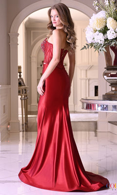 A woman wearing a Long Prom Dress: Colors Dress 4161, a floor-length red strapless mermaid dress with a beaded, lace corset-style bodice.