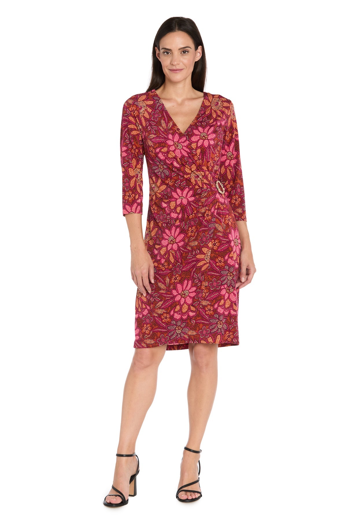Woman wearing the R&M Richards 4171 red knee-length party dress, paired with black heeled sandals, standing against a white background.