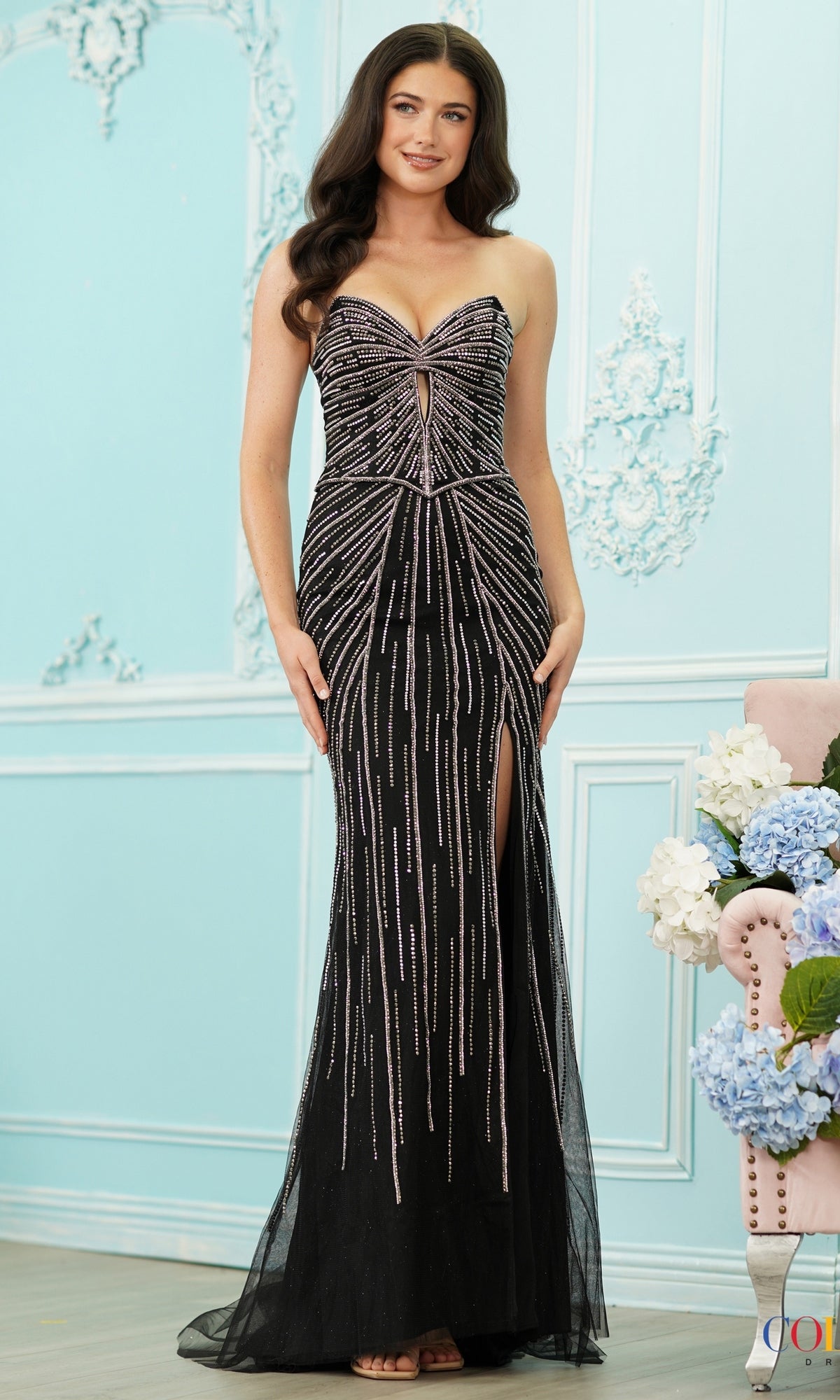 Colors Dress 4176 strapless black floor-length beaded prom dress featuring a sweetheart neckline, vertical embellishments, and a side leg slit.