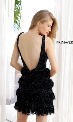 A woman in the Primavera 4203 Ruffled Short Sequin Hoco Dress with a deep open back stands near white curtains, facing away. "PRIMAVERA" is displayed beside her.