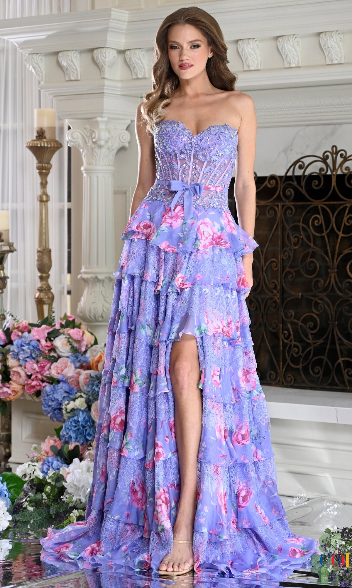 Lavender Colors Dress 4206 strapless cottagecore prom dress with a floral print, corset bodice, high leg slit, and a tiered ruffled skirt.