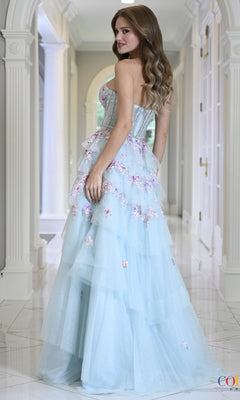 Colors Dress 4209 is a strapless, light blue floor-length floral glitter tulle prom dress with a corset-style bodice and a tiered skirt embellished with 3D flower embroidery.