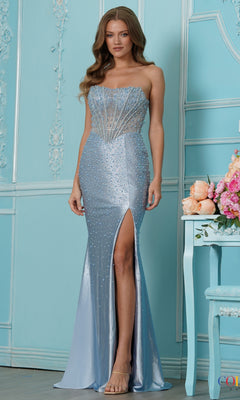 A woman wears a blue Long Prom Dress: Colors Dress 4218, a strapless, floor-length corset gown with a beaded bodice and a high thigh slit.