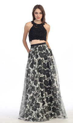 A woman poses against a white background wearing the Eureka 4222 long formal dress, featuring a black lace crop top and a high-waisted, floral chiffon skirt.