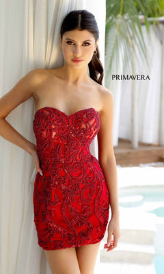 A woman in the Strapless Beaded Short Hoco Dress: Primavera 4227 stands by a white curtain near a pool, with "PRIMAVERA" displayed in the background.