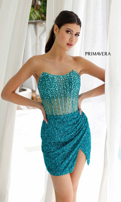 A woman in a teal, strapless sequin dress poses by white curtains with "PRIMAVERA" on the backdrop, highlighting the glamorous Short Homecoming Dress 4231 by Primavera—a fitted beaded mini party dress.