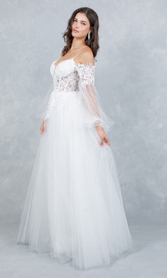 A woman stands against a light grey textured background wearing the Long Formal Dress: Cinderella Couture 4234 in Off White, featuring a delicate lace applique and an off-the-shoulder corset bodice.