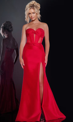 A woman poses against a dark background, her reflection visible on the left, wearing the Jovani 42375 Long Prom Dress: a strapless red gown with a corset bodice, floor-length skirt, and high slit.