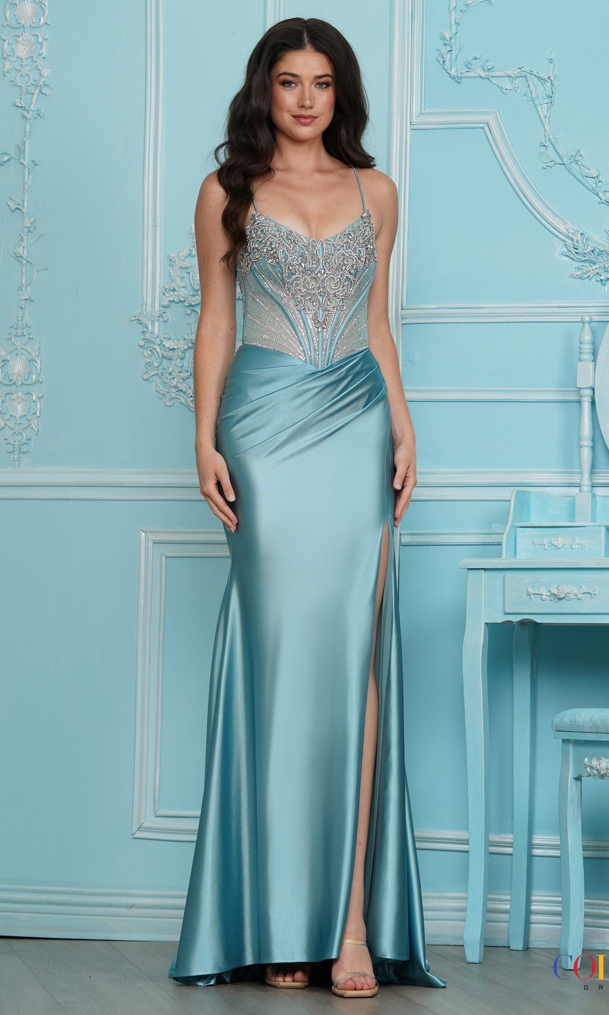 Long Prom Dress: Colors Dress 4242 in seafoam, a floor-length metallic jersey gown featuring a beaded bodice, corset-style waist, and side slit.