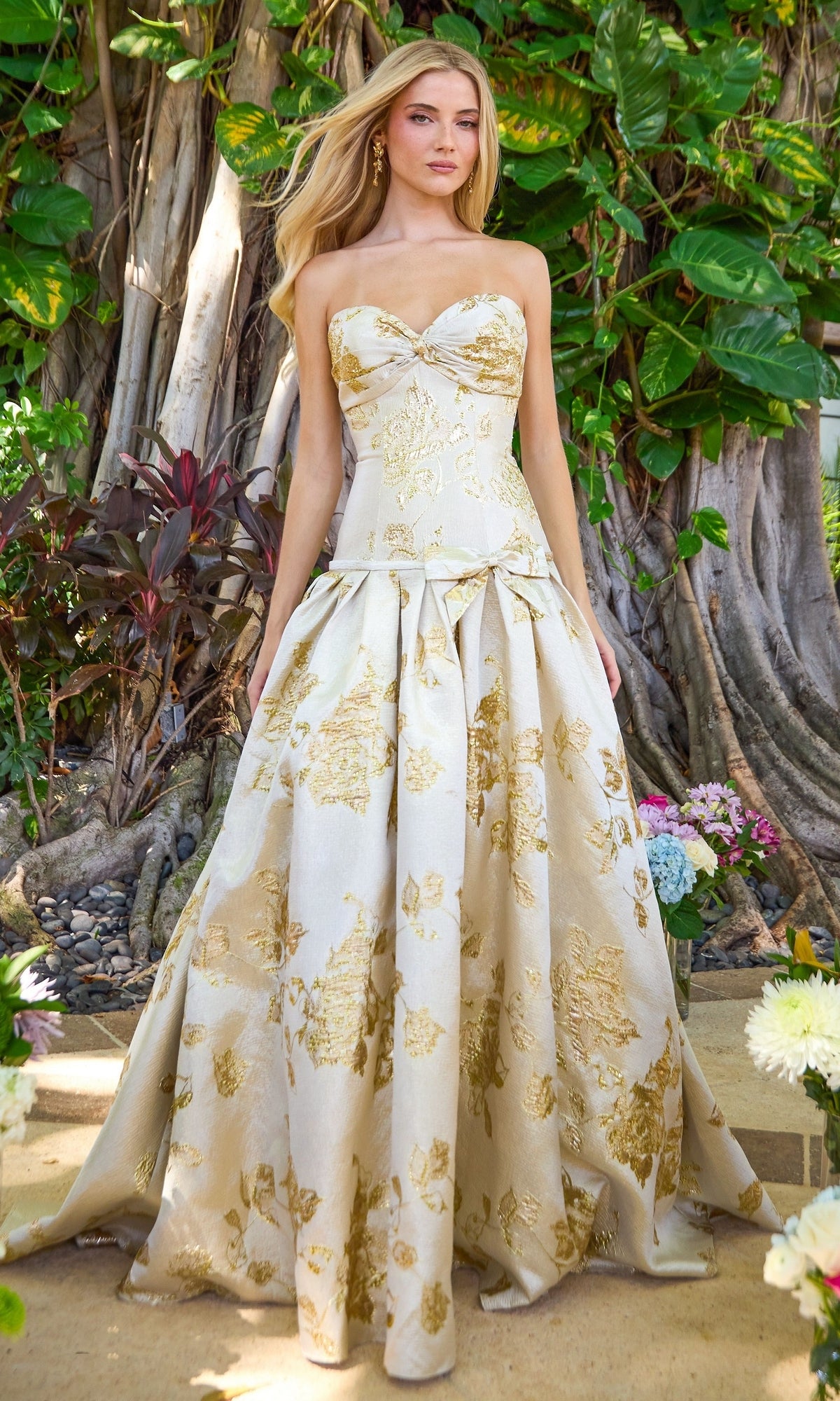 Ava Presley 42460 cream and gold floral brocade ball gown featuring a strapless sweetheart neckline and a voluminous full skirt.