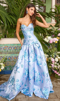 Long Prom Dress: Ava Presley 42460, a strapless, floor-length light blue ball gown with a sweetheart neckline, defined waist, and dark blue floral pattern.