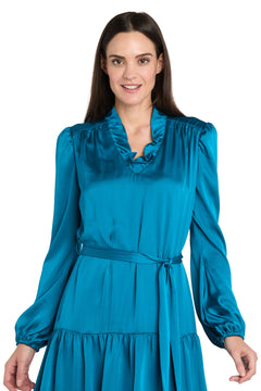 A woman wearing the R&M Richards 4246 short teal party dress, standing and smiling at the camera.