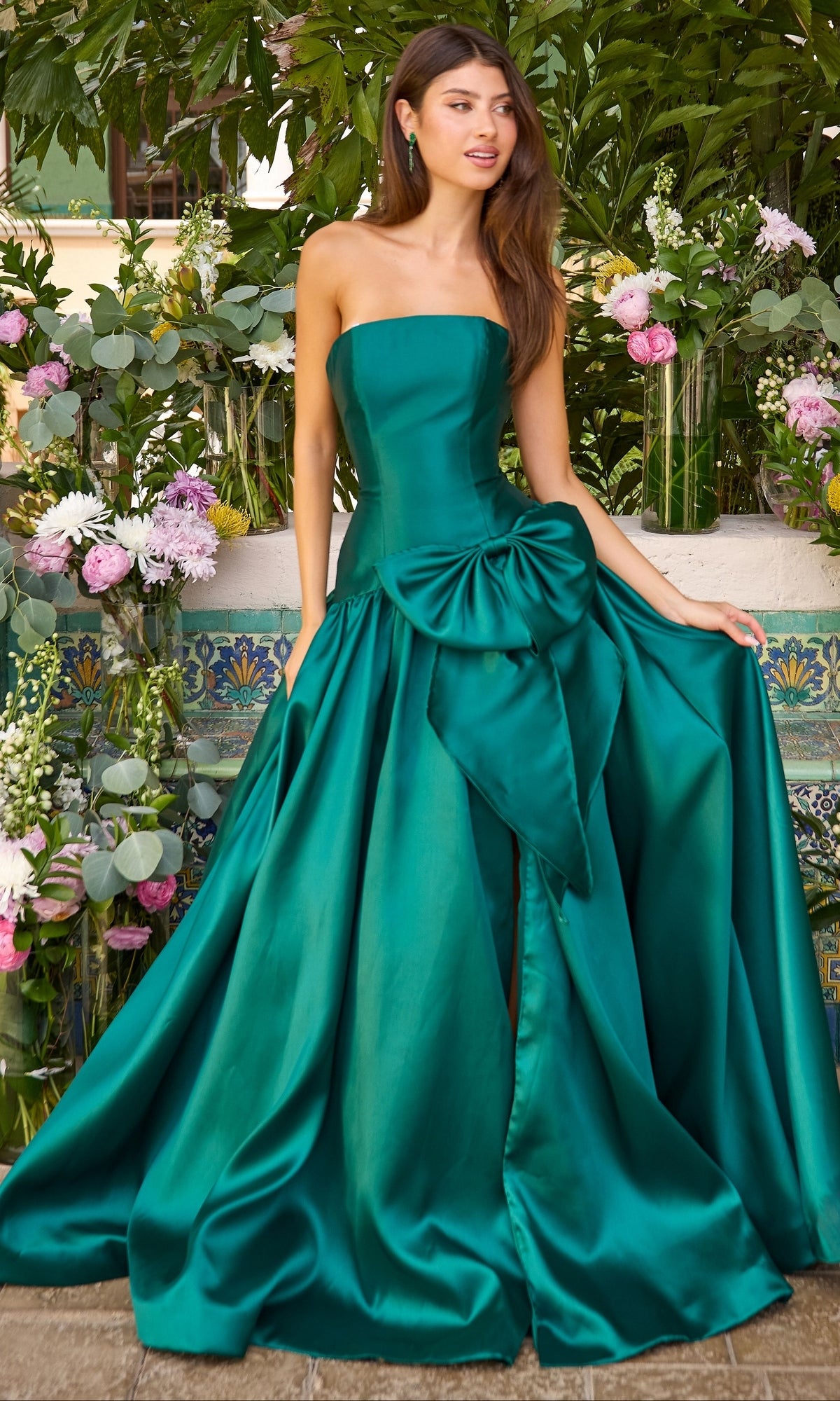 Strapless emerald green Long Prom Dress: Ava Presley 42477 featuring a large bow detail at the waist and a high slit.