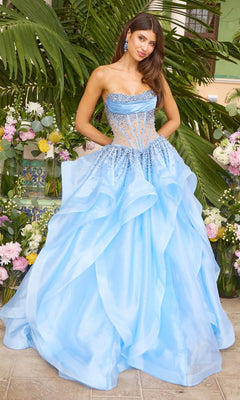 The Ava Presley 42482 is a strapless periwinkle prom dress featuring a beaded, corset-style bodice and a voluminous layered ball gown skirt.