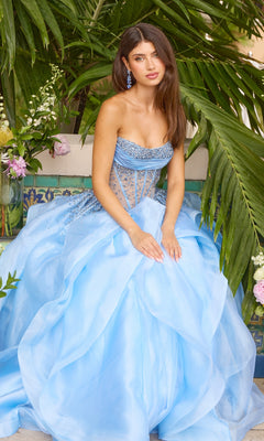A woman wearing a strapless, periwinkle Ava Presley 42482 ball gown with a beaded bodice and a full, layered skirt.