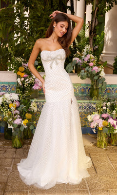 This strapless, floor-length Long Prom Dress: Ava Presley 42489 is white with a beaded bow at the bodice and small dark polka dots throughout.