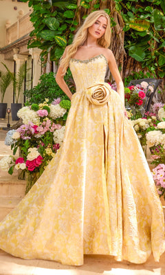 Ava Presley 42517 strapless yellow floral prom ball gown with a large fabric rose at the waist and a thigh-high slit.