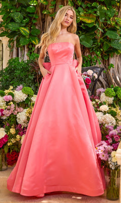 A coral Ava Presley 42523 strapless floor-length ball gown featuring a full skirt, pockets, and a bow-back design.