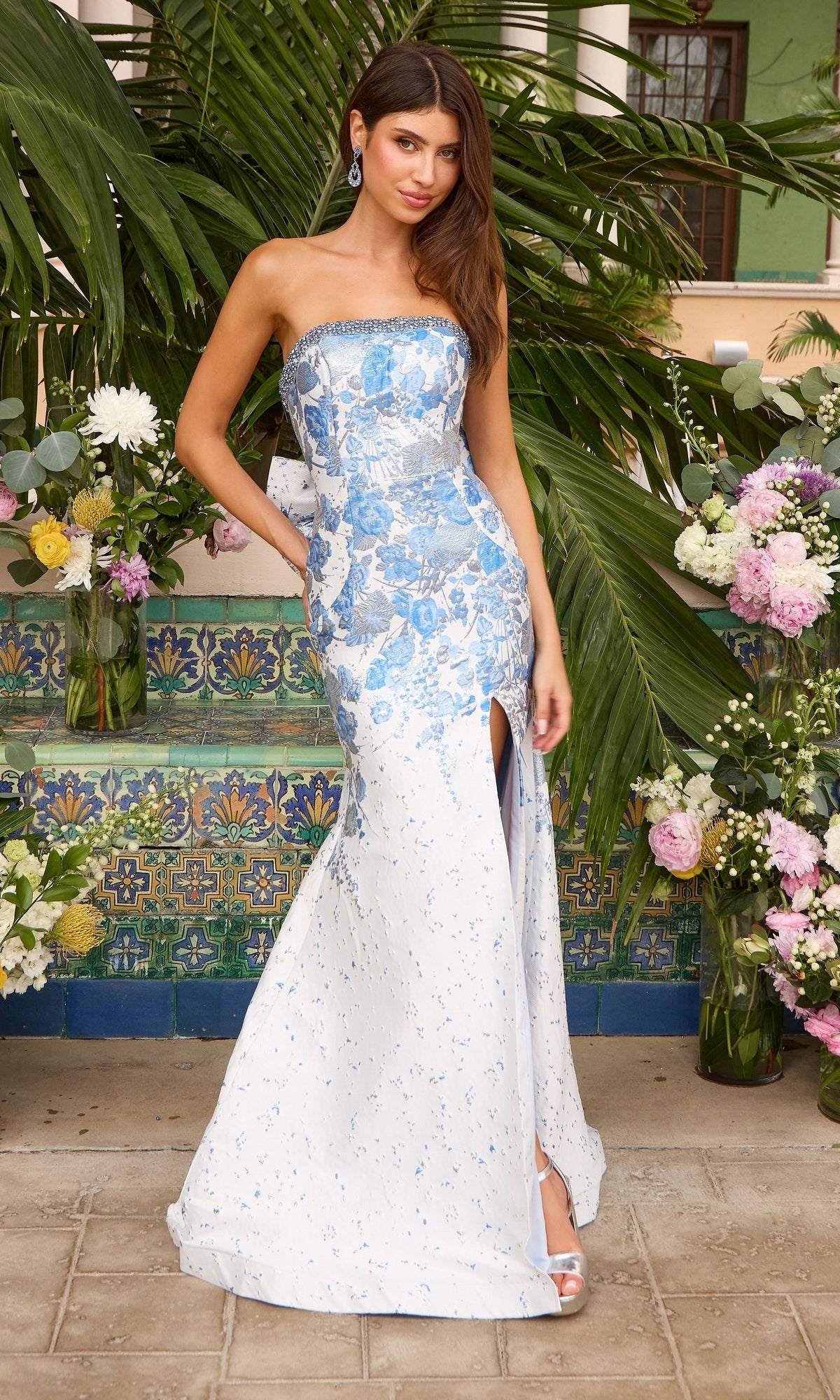 Ava Presley 42535 strapless, floor-length mermaid prom dress in a blue and white floral brocade with a high leg slit.