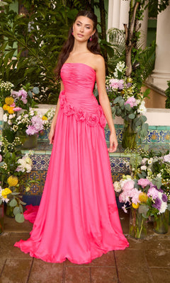 A strapless, hot pink Ava Presley 42536 prom dress with a ruched bodice and a row of fabric roses at the waist.