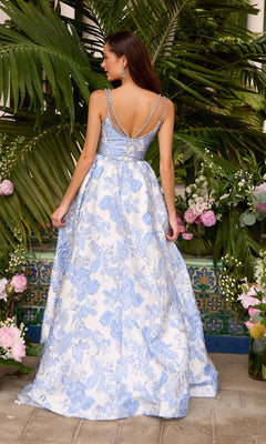 Back view of the Long Prom Dress: Ava Presley 42549, featuring a sleeveless, floor-length A-line silhouette with a blue and white floral print and a beaded crossover back strap.