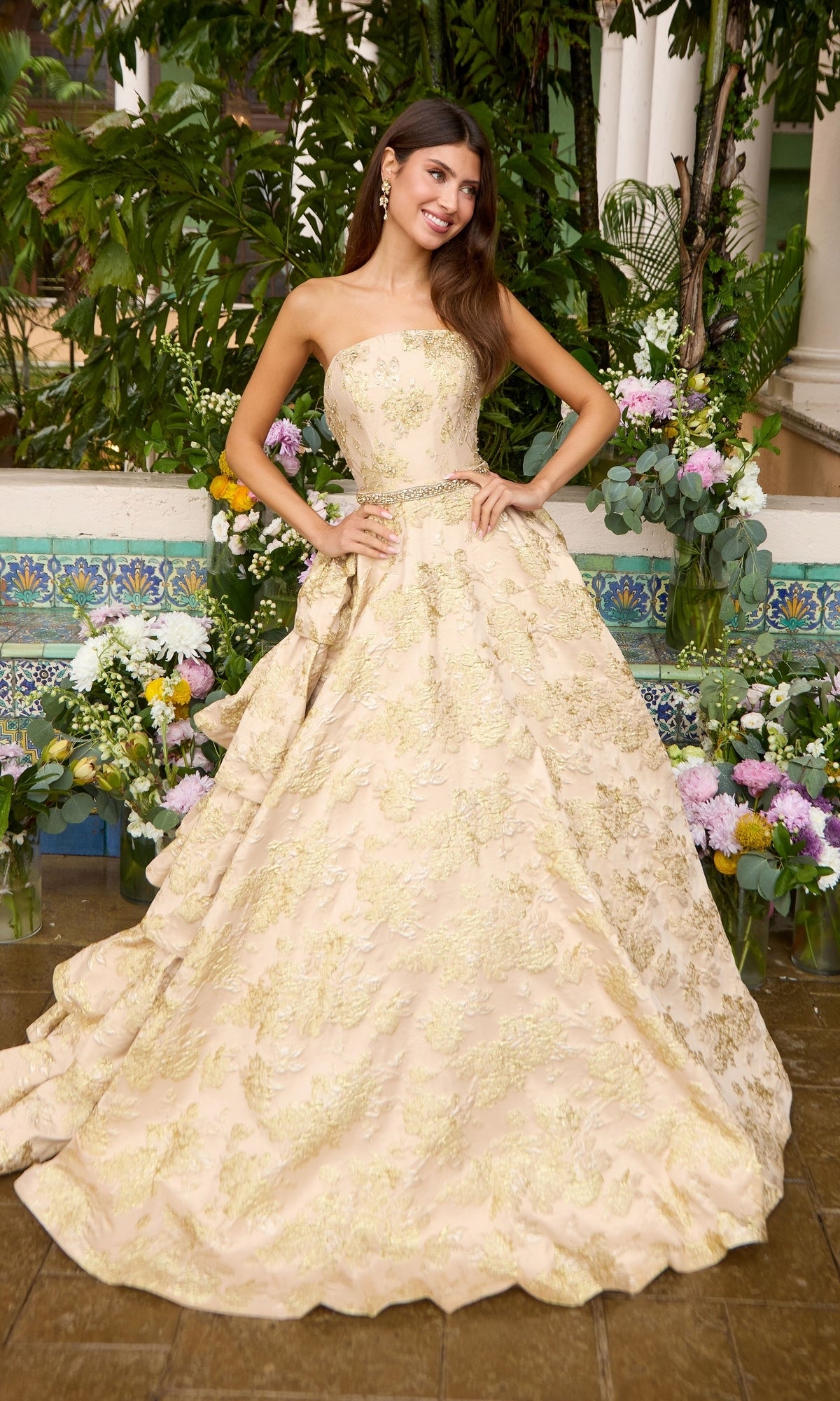 Ava Presley 42555 gold strapless metallic floral ballgown with a beaded waist and a tiered skirt.