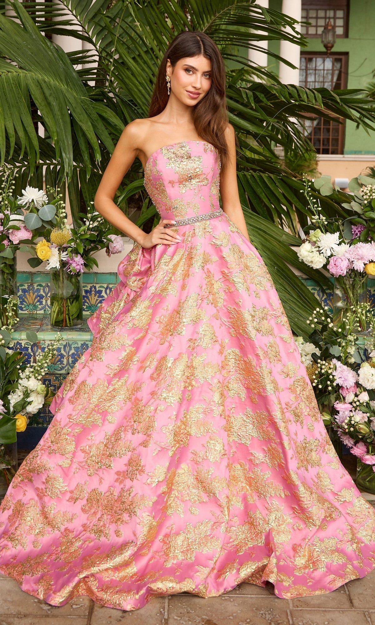Ava Presley 42555 hot pink and gold strapless metallic floral prom dress with a jeweled waistline and a tiered ballgown skirt.