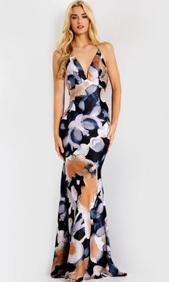 A woman wears the Jovani 42562 long prom dress in a bold print, featuring a sleeveless design, floor-length skirt, plunging neckline, and striking black, white, and copper abstract floral patterns.