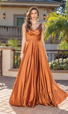 Outdoors, a woman wears the Wrap-Bodice Long A-Line Prom Dress with Corset—a sleeveless copper satin gown featuring a V-neckline and full, flowing skirt, capturing this season’s elegant style.