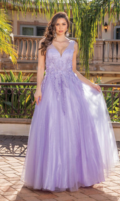 A woman stands outdoors wearing the Backless Glitter Tulle Ball Gown Prom Dress 4272, a sleeveless, floor-length gown with floral embroidery, appliqué, a deep V-neckline, and a shimmering lavender finish.