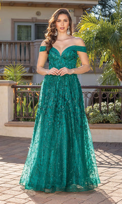 A woman in the Long Formal Dress 4273, a teal off-the-shoulder ball gown with sequin details, stands by an outdoor railing with greenery and a building in the background.