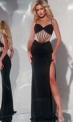 A woman poses in front of a mirror wearing the Jovani 42758 Long Prom Dress, a black evening gown featuring a high slit, sweetheart neckline, and geometric jeweled accents.