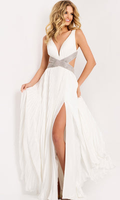 A woman models the Jovani 42811 long prom dress—a sleeveless chiffon gown with a deep V-neckline, embellished waistband, and high slit—standing against a plain light background.