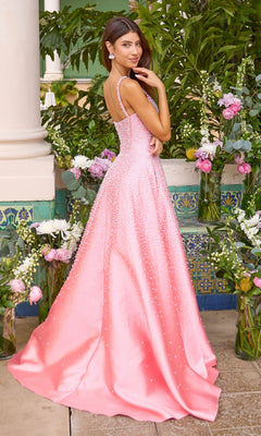 A woman wears an Ava Presley 43065 long prom dress, a floor-length, beaded pink corset gown with a full A-line skirt.