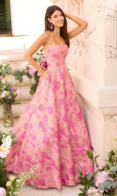 A woman wears an Ava Presley 43082 strapless pink ballgown with a gold floral pattern.