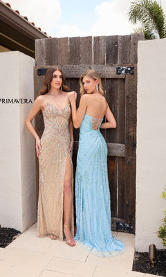 Two women stand outdoors by a wooden gate, each in a Cut-Out Strapless Sequin Prom Gown: Primavera 4309—one gold, one light blue—radiating elegance for any formal event.