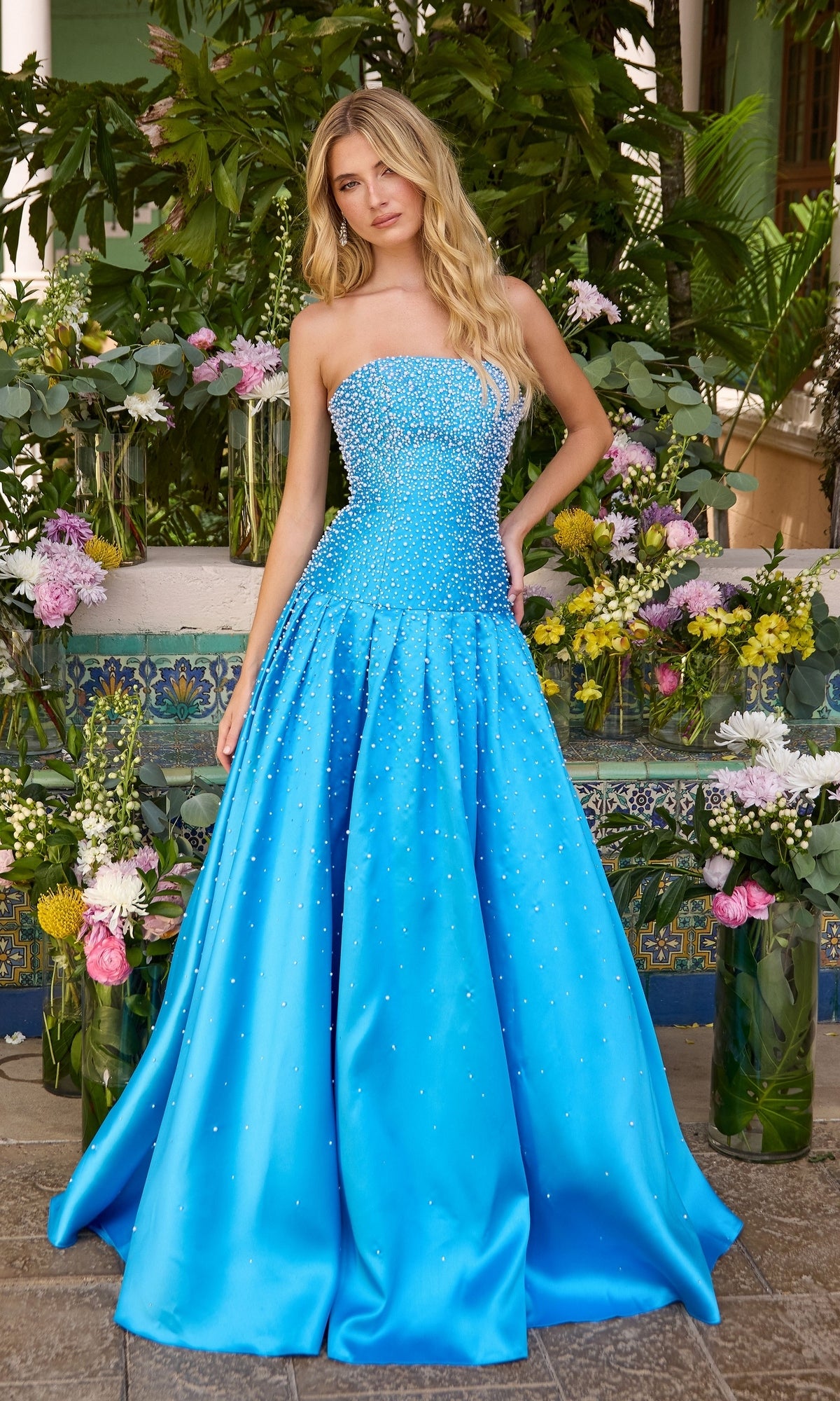 Long Prom Dress: Ava Presley 43093, a strapless, floor-length ocean and white ball gown embellished with beads.