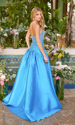 A woman wearing a blue pearl Long Prom Dress: Ava Presley 43093, a strapless, floor-length gown embellished with beads.