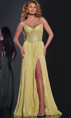 A woman poses in the Jovani 43115 Long Prom Dress, featuring a strapless embellished corset bodice and a yellow floor-length skirt with a thigh-high slit, set against a dark background.