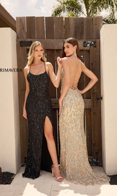 Two women stand before a wooden gate—one wears the Primavera 4312 long prom dress in black with sequins and a leg slit, while the other is dressed in a gold gown with an open back and sparkling sequin accents.