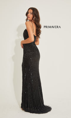 A woman poses against a plain white background in the Long Prom Dress: Primavera 4327, a floor-length sequined gown with an open back. "PRIMAVERA" is displayed beside her.