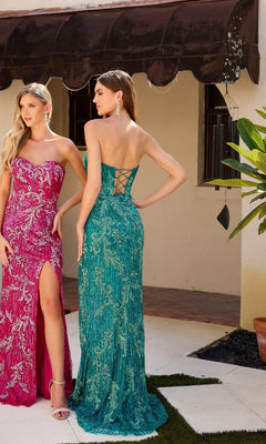 Two women stand outdoors in Strapless Sequin-Print Prom Gown: Primavera 4328—one wears pink with a thigh-high slit, the other teal with a lace-up back. Both long strapless dresses shimmer beautifully in the light.