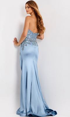 Woman wearing the Jovani 43415 long prom dress in light blue satin with silver floral embellishments and a corset bodice, standing with her back to the camera against a plain white background.