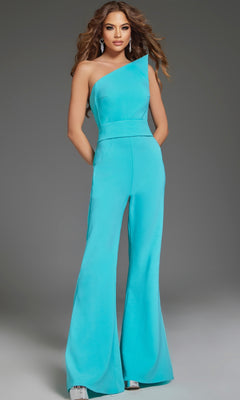 A woman poses in the Jovani 43567 strapless formal jumpsuit with flared legs and silver platform heels against a gray background.