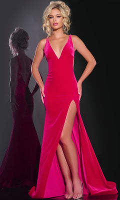 A woman in the Jovani 43578 long prom dress—a sleeveless, bright pink gown with a deep V-neckline and high slit—stands against a dark background, her reflection visible beside her.